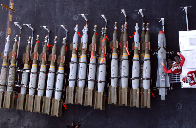 Maverick missile at fight next to an array of bombs.